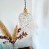 Lampe baladeuse globe en verre facetté des années 70. Luminaire vintage Bloomis