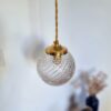 Lampe baladeuse globe verre et son cordon tressé à personnaliser. Luminaire vintage Bloomis